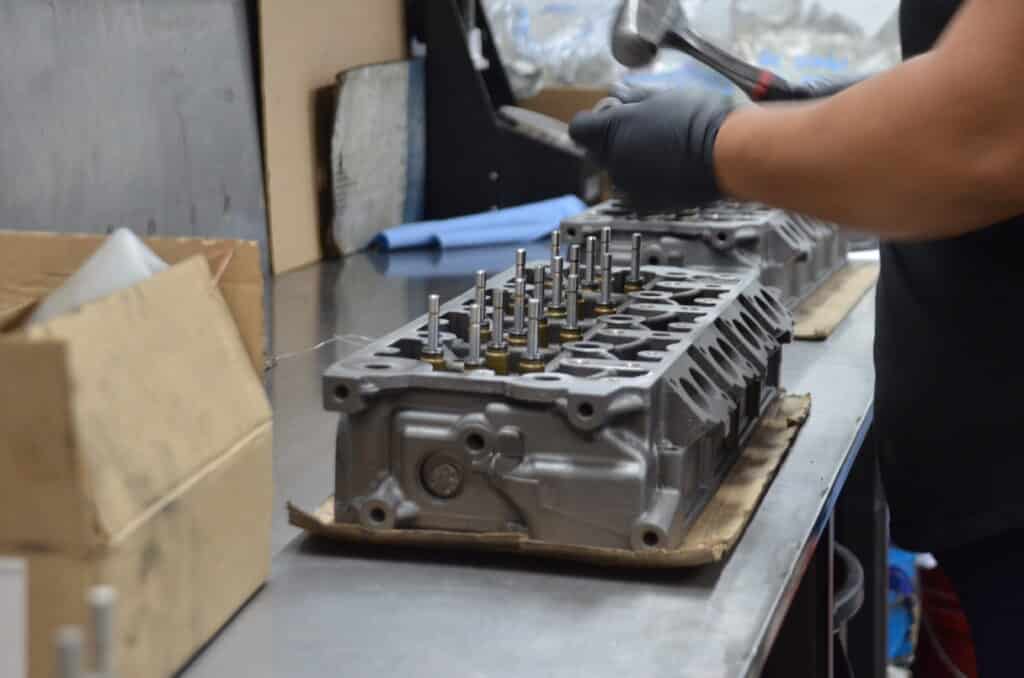 engine remanufacturer replacing parts in a reman engine